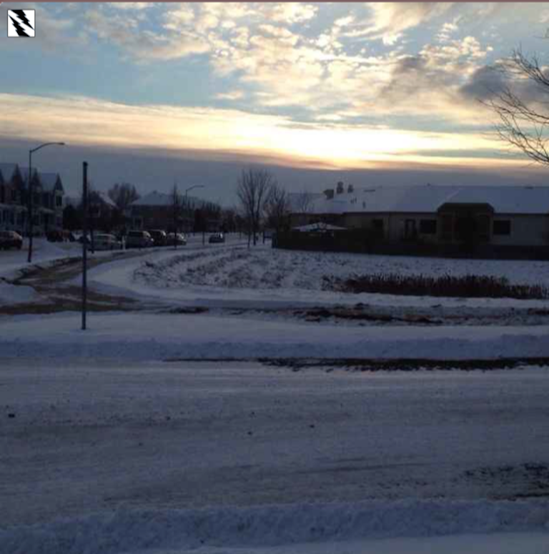 field with alternating patches of snow and ground